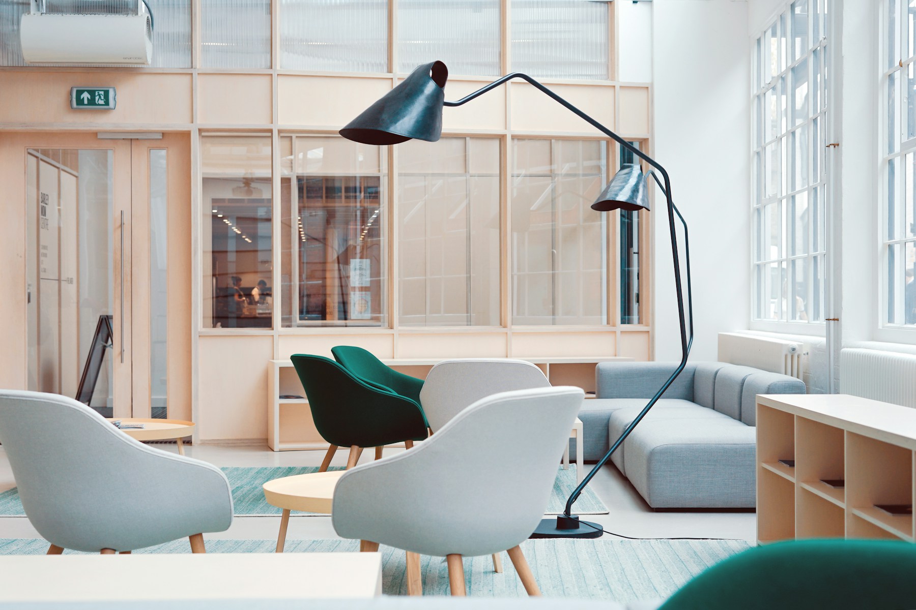 Interior design and project team collaborating around plans in a modern studio
